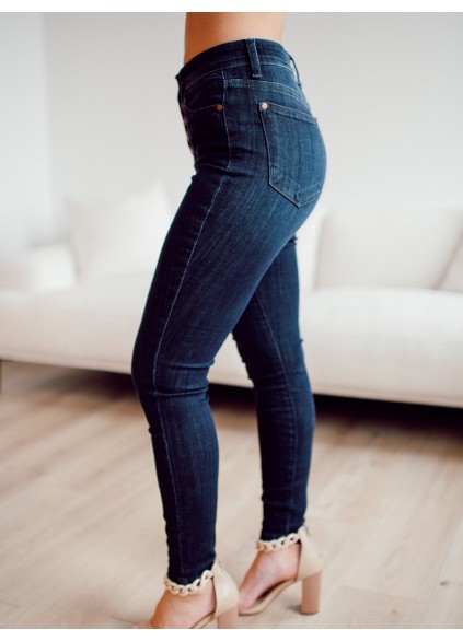 Dark blue high waisted metal button skinny jeans