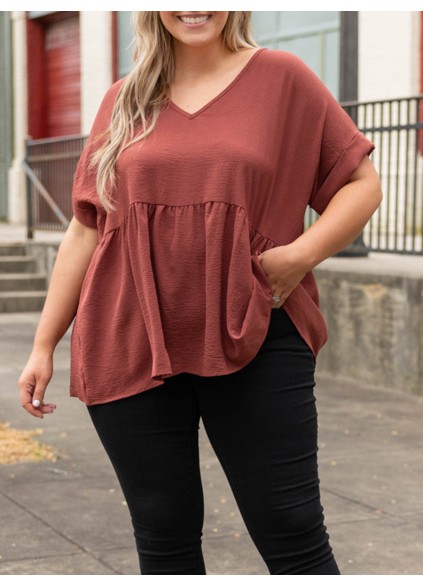 V-neck short sleeved shirt with ruffle hem